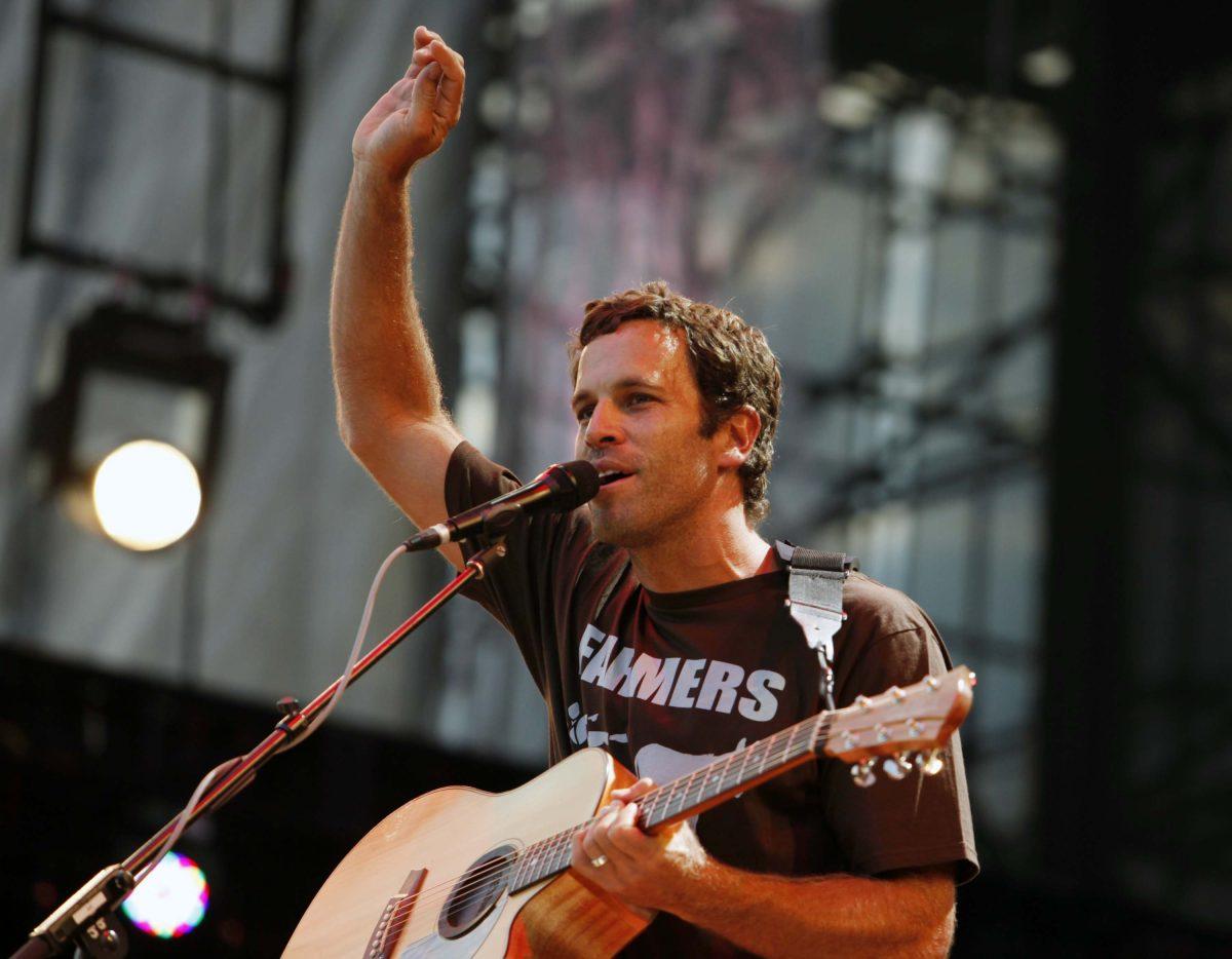 FILE - This Sept. 22, 2012 file photo shows Jack Johnson performing during the Farm Aid 2012 concert at Hersheypark Stadium in Hershey, Pa. Johnson has agreed to take the Saturday night headlining slot at the Bonnaroo Music &amp; Arts Festival after Mumford &amp; Sons were forced to cancel due to bassist Ted Dwane's illness. Festival officials announced the move Friday morning. The "Upside Down" singer last headlined at Bonnaroo in 2008. (AP Photo/Jacqueline Larma, file)