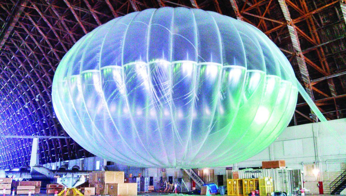 In this March 1, 2013 photo released by Google, a fully inflated test balloon sits in a hangar at Moffett Field airfield, Calif. Google is testing the balloons which sail in the stratosphere and beam the Internet to Earth. (AP Photo/Google, Andrea Dunlap) EDITORIAL USE ONLY