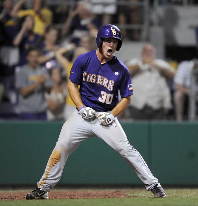 LSU freshman infielder Alex Bregman (30) celebrates June 1, 2013 after scoring the game-tying run in the eighth inning of the Tigers' Regional matchup with Sam Houston. LSU would eventually win, 8-5.
 