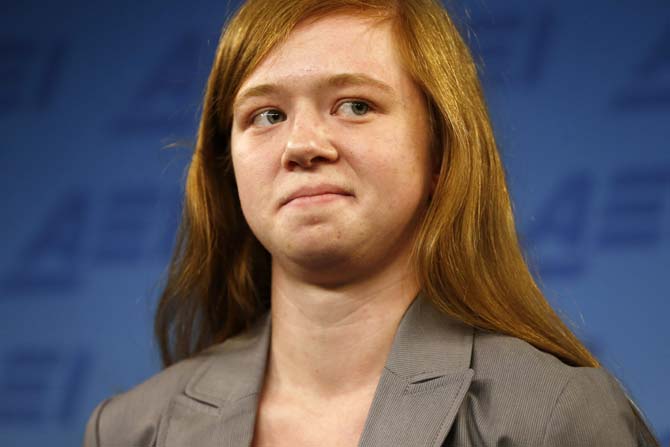 Abigail Fisher, who sued the University of Texas when she was not offered a spot at the university's flagship Austin campus in 2008, stands at a news conference at the American Enterprise Institute in Washington, Monday, June 24, 2013. The U.S. Supreme Court ruling on affirmative action in higher education will have "no impact" on the University of Texas' admissions policy, school president Bill Powers said Monday, noting UT will continue to use race as a factor in some cases. (AP Photo/Charles Dharapak)
 