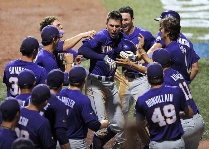 LSU junior infielder JaCoby Jones (23) celebrates with his teammates after his home run June 8, 2013 during the Tigers' 11-1 win against Oklahoma in Alex Box Stadium.
 