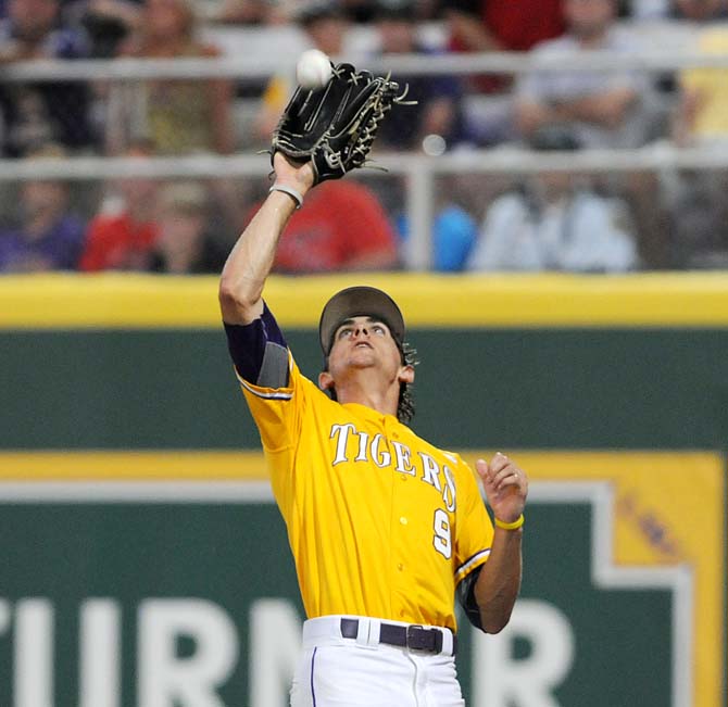 LSU freshman outfielder Mark Laird (9) catches a ball in foul territory June 2, 2013 during the Tigers' 5-1 win against ULL in Alex Box Stadium.
 