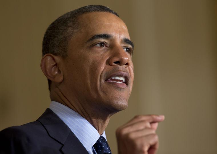 President Barack Obama gestures while speaking in the East Room of the White House in Washington, Monday, June 10, 2013, during a ceremony to commemorate the 50th anniversary of the Equal Pay Act. Obama highlighted the gap in pay that still exists between men and women. (AP Photo/Evan Vucci)
 