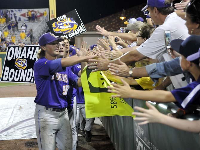 LSU senior closer Chris Cotton (58) and the rest of the LSU baseball team celebrate with fans June 8, 2013 after the Tigers' 11-1, Super Regional win against Oklahoma in Alex Box Stadium.
 