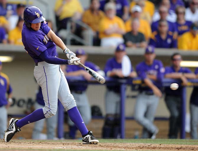 LSU junior infielder JaCoby Jones (23) hits the ball June 8, 2013 during the Tigers' 11-1 win against Oklahoma in Alex Box Stadium. Jones led the LSU offense with four hits and three RBI's.
 