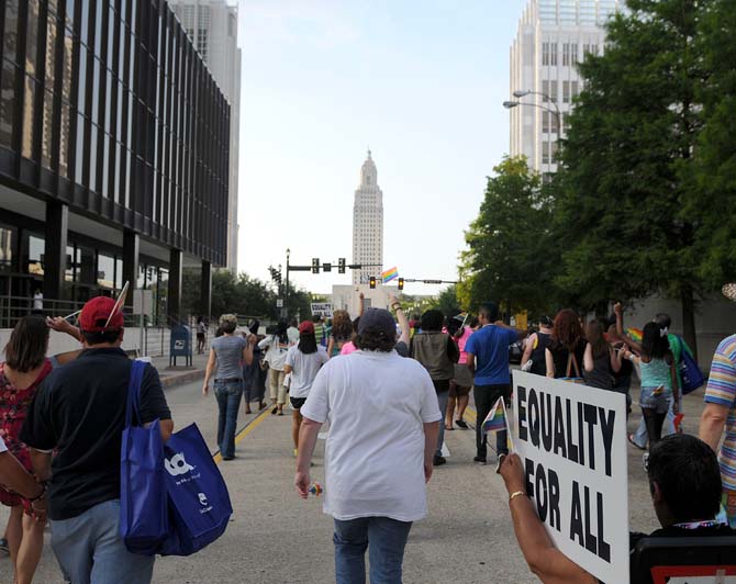 LGBTQ Pride ralliers march down North 4th Street June 15, 2013 in downtown Baton Rouge.
 