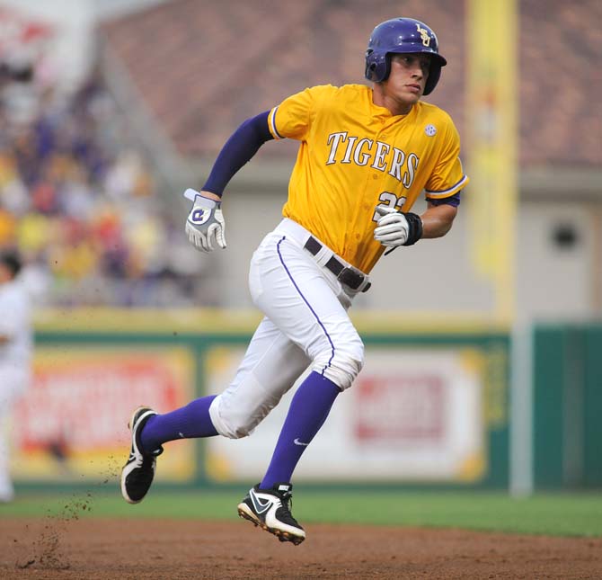 LSU junior infielder JaCoby jones (23) approaches third base June 2, 2013 during the Tigers ' 5-1 win against ULL in Alex Box Stadium.
 