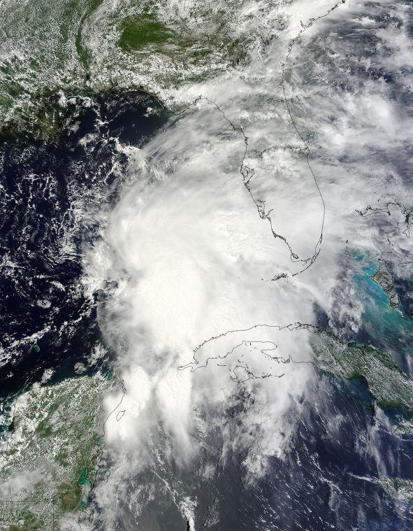 An image provided by NASA from the Terra satellite shows Tropical Storm Andrea as it moves across the Gulf of Mexico and approaches Florida's west coast on Wednesday June 5, 2013 at 12:25 p.m. EDT. Heavy rain poured across much of Florida on Thursday as the first tropical storm of the Atlantic hurricane season headed toward the state.
 