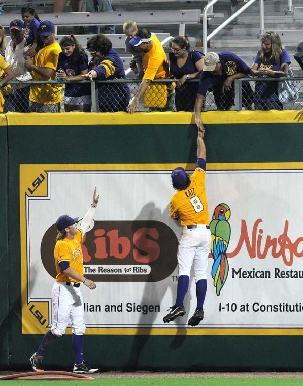 LSU seniors Raph Rhymes (4) and Mason Katz (8) celebrate with fans June 2, 2013 following the Tigers' 5-1 win against ULL in Alex Box Stadium.
 