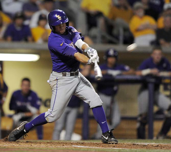 LSU senior infielder Mason Katz (8) hits the ball June 8, 2013 during the Tigers' 11-1 win against Oklahoma in Alex Box Stadium.
 