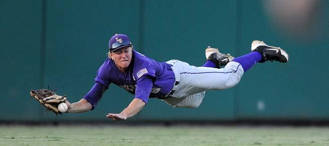 LSU freshman outfielder Andrew Stevenson (6) dives for an out June 1, 2013 during the Tigers' 8-5 win against Sam Houston in Alex Box Stadium.
 