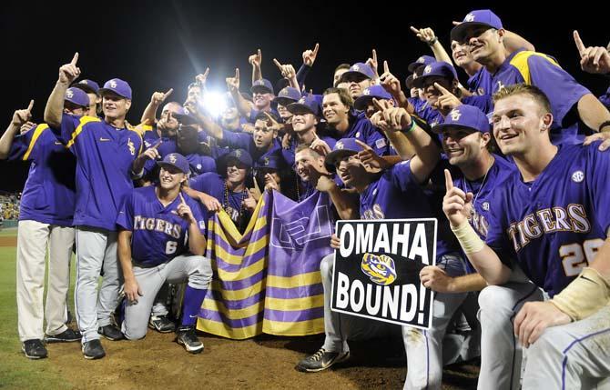 The LSU baseball team poses on the pitcher's mound in Alex Box Stadium June 8, 2013 after securing a trip to Omaha with an 11-1 win against Oklahoma.
 