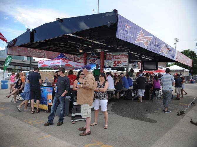 Fans gather at The Old Matress Factory tailgate June 16, 2013 before the LSU vs. UCLA game at the College World Series outside of TD Ameritrade Park in Omaha, Nebraska.
 