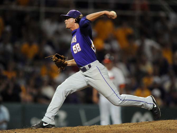 LSU senior pitcher Chris Cotton (58) throws the ball June 1, 2013 during the Tigers' 8-5 win against Sam Houston in Alex Box Stadium. The game was Cotton's 16th save, tying the school record held by Matty Ott.
 