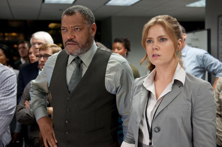 This film publicity image released by Warner Bros. Pictures shows Laurence Fishburne as Perry White, left, and Amy Adams as Lois Lane in "Man of Steel." (AP Photo/Warner Bros. Pictures, Clay Enos)