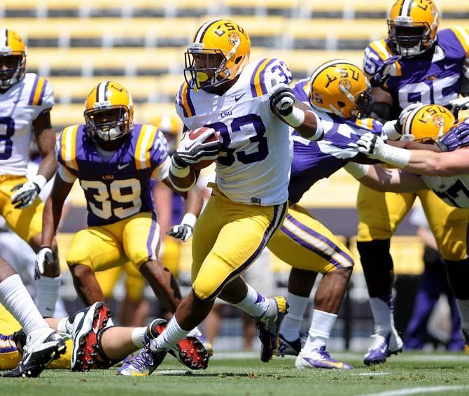 Sophomore running back Jeremy Hill (33) takes off down the field April 20, 2013 during the white squad's 37-0 victory against the purple squad in the National L Club Spring Game in Tiger Stadium.