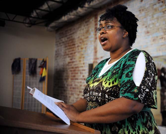 Sylvia Chatman, a local poet also known by her stage name "Sincere Scribe," recites poetry July 10, 2013 at The Red Shoes in Baton Rouge.