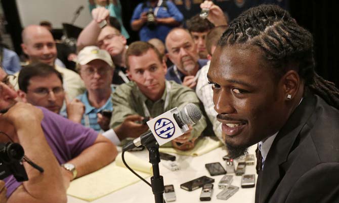 South Carolina's Jadeveon Clowney talks with reporters during the Southeastern Conference football media days in Hoover, Ala., Tuesday, July 16, 2013. (AP Photo/Dave Martin)