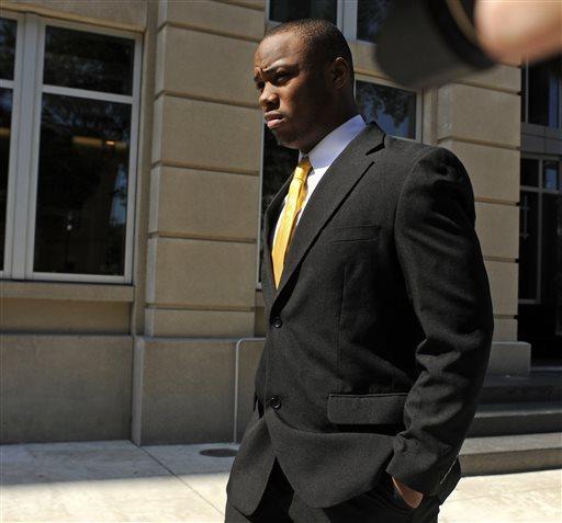 Suspended LSU running back Jeremy Hill leaves state district court in Baton Rouge, La., Friday, July 12, 2013. Hill has pleaded guilty to simple battery in connection with a bar fight in April. (AP Photo/Catherine Threlkeld)