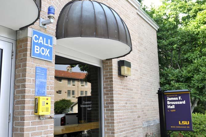 A blue light and sign sit above an emergency call box Wednesday outside of Broussard Hall.