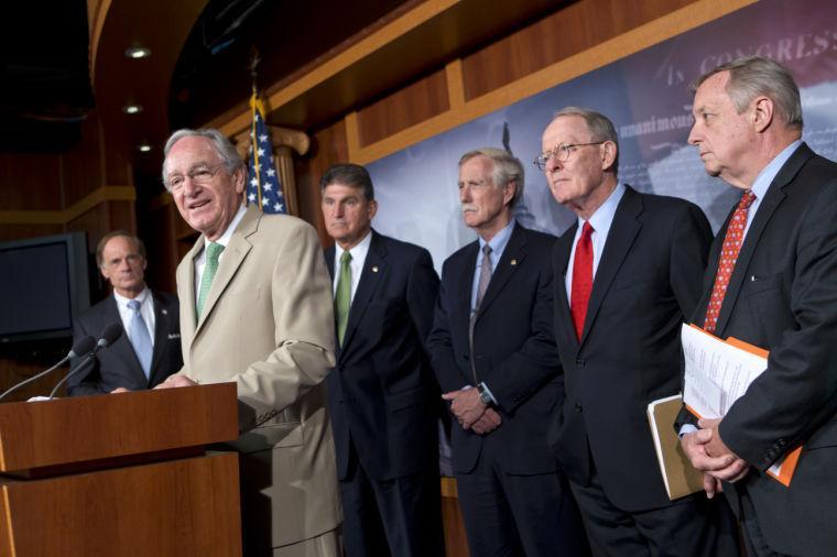 Sen. Tom Harkin, D-Iowa, chair of the Senate Education Committee, announces to reporters that a bipartisan agreement was reached on rates for government student loans, at the Capitol in Washington, Thursday, July 18, 2013. From left to right are Sen. Tom Carper, D-Del., Sen. Tom Harkin, D-Iowa, Sen. Joe Manchin, D-W.V., Sen. Angus King, I-Maine, Sen. Lamar Alexander, R-Tenn., and Sen. Dick Durbin, D-Ill. (AP Photo/J. Scott Applewhite)