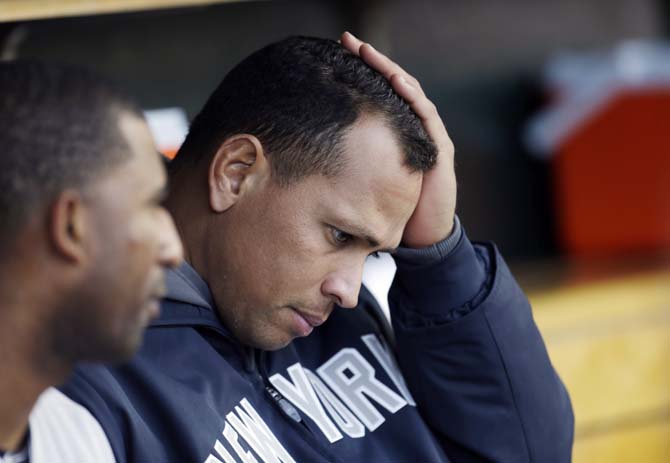 FILE - In this Oct. 18, 2012, file photo, New York Yankees' Alex Rodriguez watches from the dugout during Game 4 of the American League championship series against the Detroit Tigers in Detroit. Injuries have kept him off the field for more than half the season and now A-Rod faces discipline from Major League Baseball in its drug investigation, possibly up to a lifetime ban.(AP Photo/Paul Sancya, File)