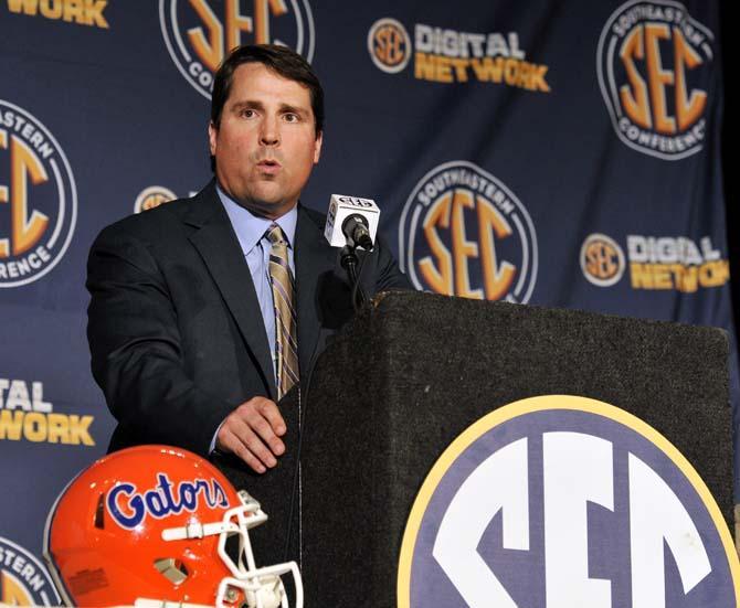 Florida head football coach Will Muschamp speaks to reporters Tuesday, July 16, 2013 at SEC Football Media Days in Hoover, Ala.