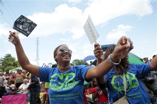 Shameika Marshall-Corbin dances during the Essence Festival's Family Reunion Day at Woldenberg Park in New Orleans Thursday, July 4, 2013. (AP Photo/Nola.com/The Times-Picayune, Brett Duke)