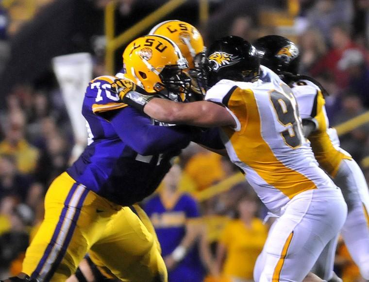 LSU sophomore offensive guard La'el Collins blocks a Towson player Saturdya, Sept. 29, 2012 during the Tigers' 38-22 win over Towson in Tiger Stadium.