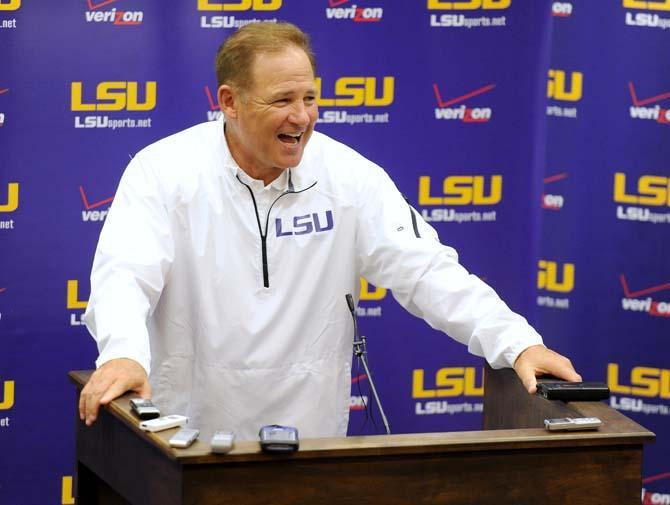 LSU head coach Les Miles enthusiastically responds to questions from various media outlets Sunday, August 11, 2013 in the Football Operations Center.