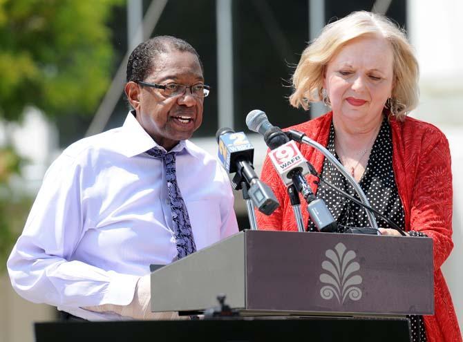 Baton Rouge Mayor-President Kip Holden (left) and Marmillion/Gray Media president Rannah Gray (right) announced the addition of Red Stick Revelry, a New Year's Eve celebration, on August 28, 2013, at a news conference in Town Square. The event will include a countdown to midnight with the descent of a red stick sculpture along with live entertainment.