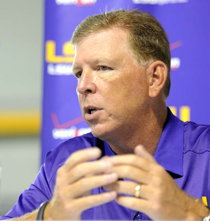 LSU offensive coordinator Cam Cameron responds to questions from media outlets Sunday, August 11, 2013 during LSU Football Media Day in the Charles McClendon Practice Facility.