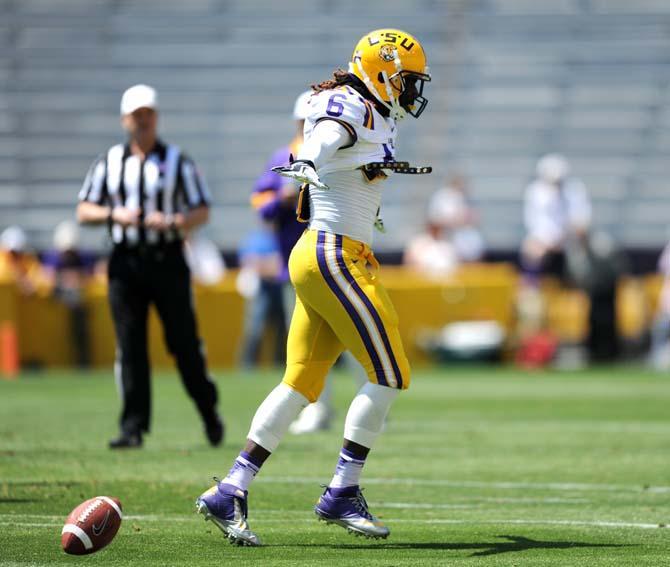 LSU senior safety Craig Loston (6) celebrates Saturday, April 20, 2013 after successfully blocking a pass in the National L Club Spring Game in Tiger Stadium.