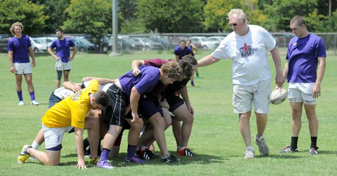 LSU Rugby coach Bob Causey runs drills at the LSU UREC practice fields Friday, Aug. 23, 2013 for the club's rugby camp.