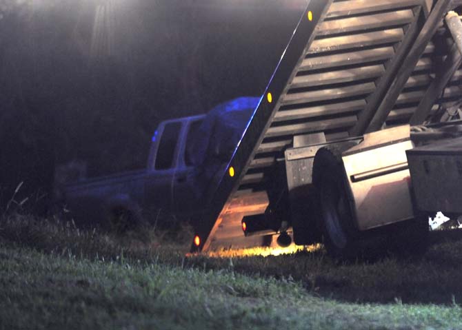 Chris Broussard's 2004 Nissan king-cab pickup truck is hooked up to a tow truck Wednesday, August 28, 2013 near Geismar, Louisiana.&#160;