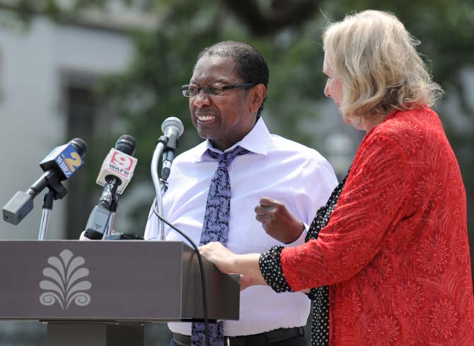 Baton Rouge Mayor-President Kip Holden (left) and Marmillion/Gray Media president Rannah Gray (right) announced the addition of Red Stick Revelry, a New Year's Eve celebration, on August 28, 2013, at a news conference in Town Square. The event will include a countdown to midnight with the descent of a red stick sculpture along with live entertainment.