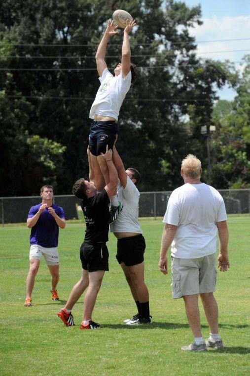 LSU Rugby coach Bob Causey runs drills at the LSU UREC practice fields Friday, Aug. 23, 2013 for the club's rugby camp.