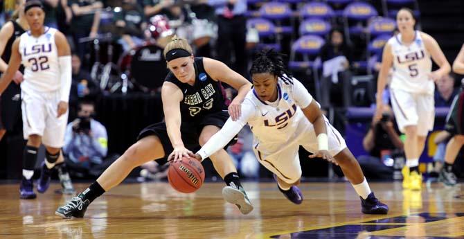 LSU senior guard Bianca Lutley (3) and Green Bay senior forward Jenny Gilbertson (25) collide as they reach for the ball Sunday, March 24, 2013 during the Tigers' 75-71 victory against the Phoenix.