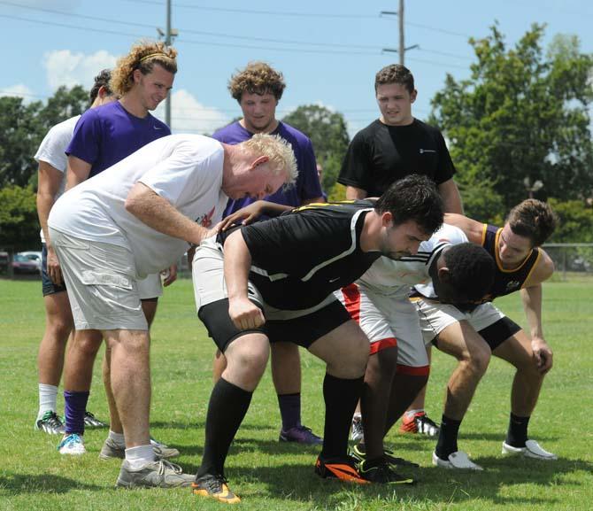 LSU Rugby coach Bob Causey runs drills at the LSU UREC practice fields Friday, Aug. 23, 2013 for the club's rugby camp.