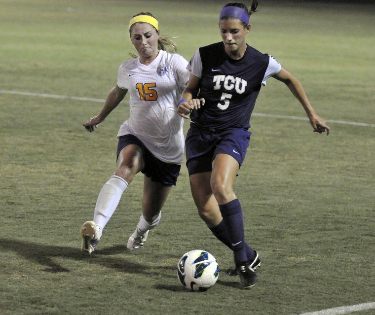 LSU senior midfielder Alex Ramsey (15) tries to steal the ball from TCU sophomore midfielder Madeline Hamm (5) on Friday, Aug. 30, 2013 as the Tigers played the Horned Frogs at LSU Soccer Stadium.