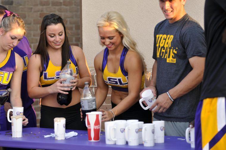 The LSU Tiger Girls prepare root beer floats for spectators before LSU faced TCU on Friday, Aug. 30, 2013 at the LSU Soccer Stadium.