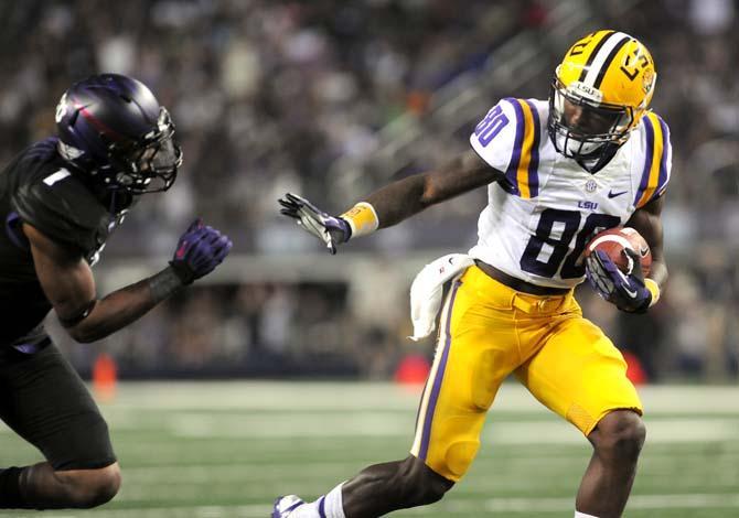 LSU junior wide receiver Jarvis Landry (80) attempts to ward off TCU sophomore safety Chris Hackett (1) during the Tigers' 37-27 victory against the Horned Frogs Saturday, August 31, 2013 in the 2013 Cowboys Classic at AT&amp;T Stadium in Arlington, Texas.