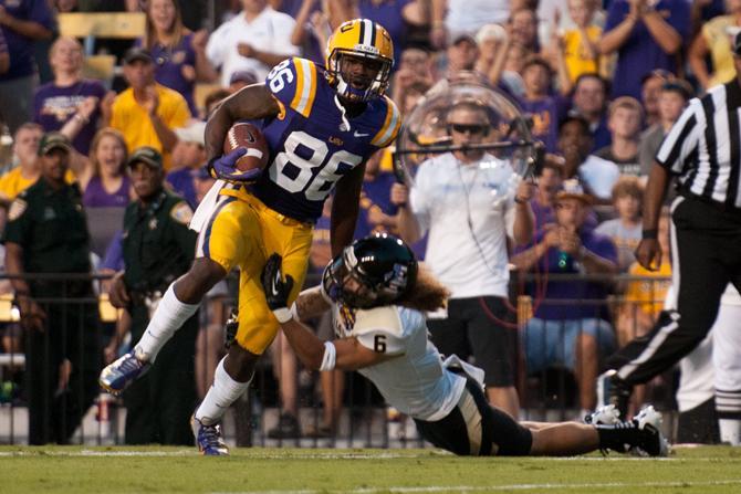 LSU junior wide receiver Kadron Booner (86) moves past Idaho cornerback Aaron Grymes (6) during the Tigers' 63-14 victory against the Vandals on Sept. 15, 2012, in Tiger Stadium.