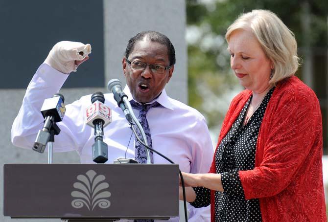 Baton Rouge Mayor-President Kip Holden (left) and Marmillion/Gray Media president Rannah Gray (right) announced the addition of Red Stick Revelry, a New Year's Eve celebration, on August 28, 2013, at a news conference in Town Square. The event will include a countdown to midnight with the descent of a red stick sculpture along with live entertainment.