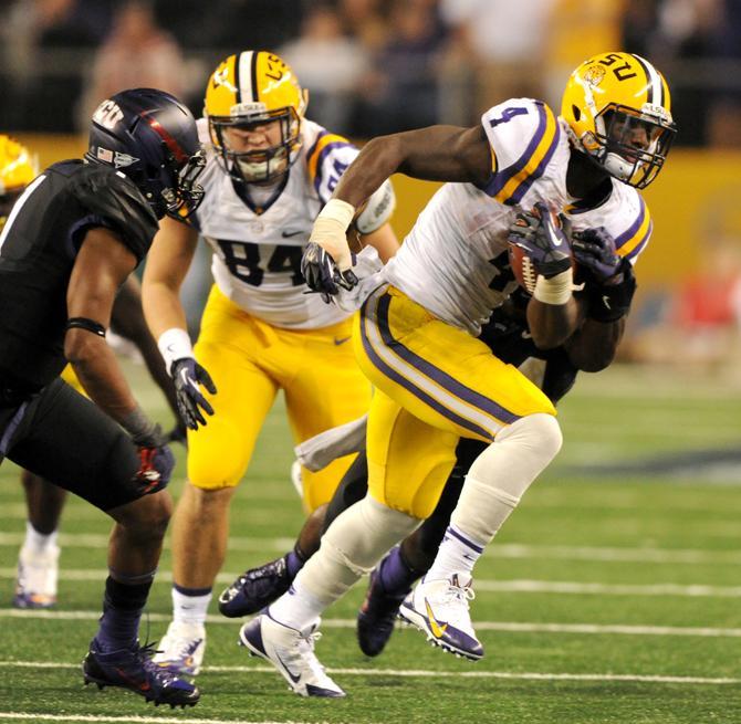 LSU senior running back Alfred Blue (4) runs the ball Aug. 31, 2013 during the 37-27 victory against TCU in the Cowboys Classic at AT&amp;T Stadium in Arlington Field.