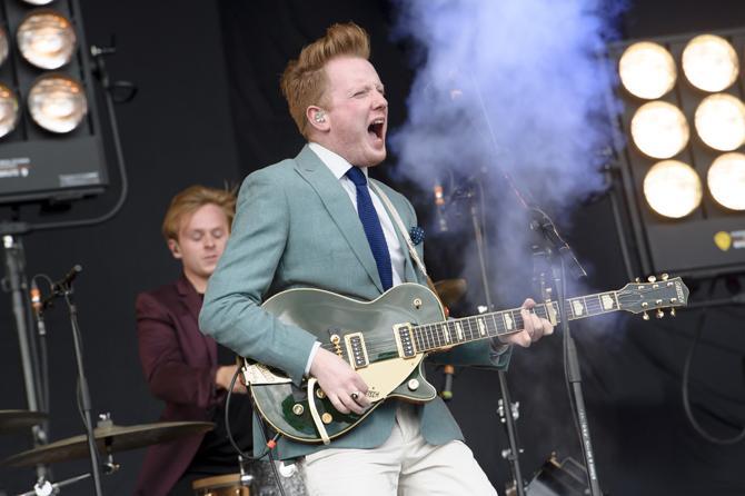 Alex Trimble from British band Two Door Cinema Club performs at the V Festival in Chelmsford, Essex, Saturday, Aug. 17, 2013. (Photo by Jonathan Short/Invision/AP)