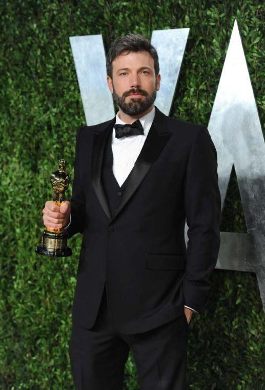 FILE - In this Feb. 24, 2013 photo, actor/director Ben Affleck arrives at the 2013 Vanity Fair Oscars Viewing and After Party, at the Sunset Plaza Hotel in West Hollywood, Calif. Affleck will don Batman's cape and cowl. Warner Bros. announced Thursday, Aug. 22, 2013, that he would star as a new incarnation of the Dark Knight in a film bringing Batman and Superman together. (Photo by Evan Agostini/Invision/AP, File)