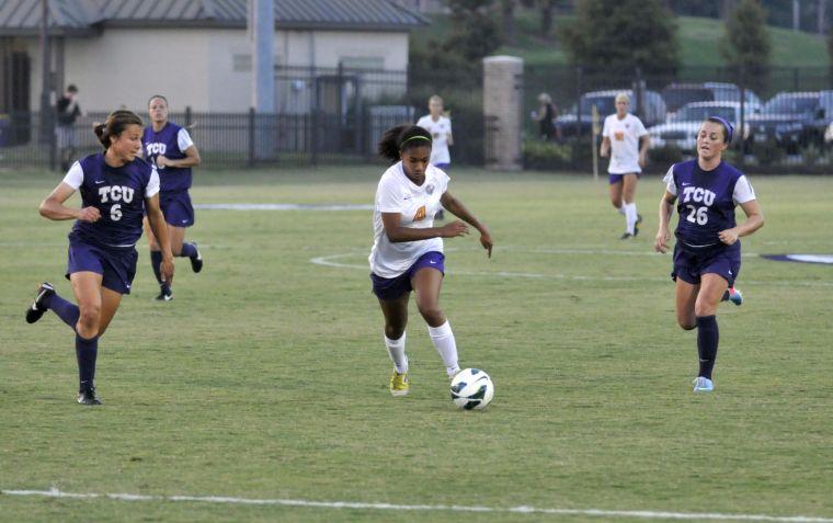 LSU freshman foward Summer Clarke (4) pursues the ball between TCU senior midfielder Maddie Payne (26) and freshman midfielder Lauren Sajewich (6) on Friday, Aug. 30 when the Tigers took on the Horned Frogs at the LSU Soccer Stadium.