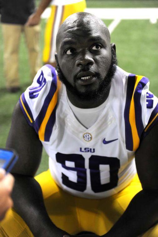 LSU junior defensive tackle Anthony Johnson (90) responds to questions from various media outlets Sunday, August 11, 2013 during LSU Football Media Day in the Charles McClendon Practice Facility.