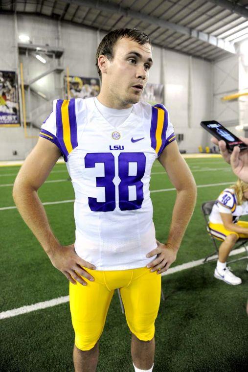 LSU sophomore punter Jamie Keehn (38) responds to questions from a reporter Sunday, August 11, 2013 during LSU Football Media Day in the Charles McClendon Practice Facility.